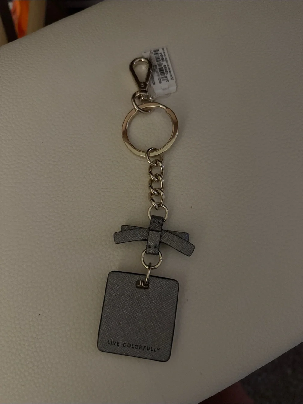 kate spade gray and gold bow spade charm key ring